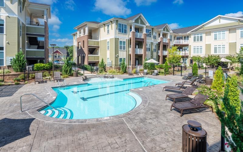 a swimming pool in front of buildings
