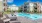 a pool in front of buildings