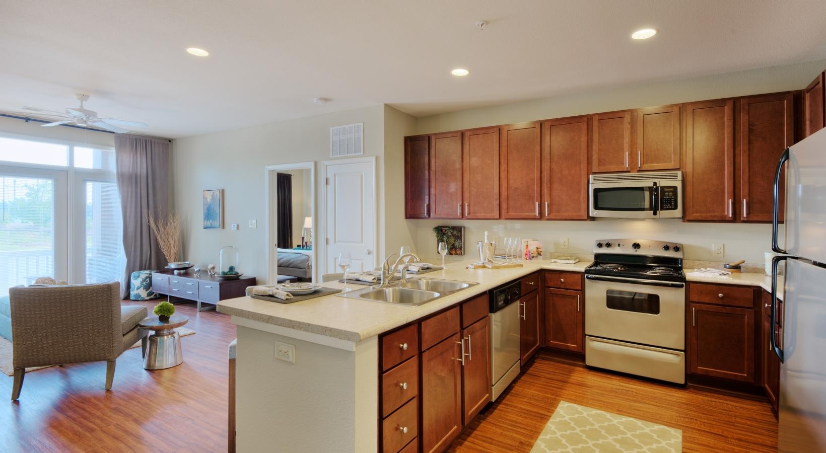 Spacious kitchens with thoughtful details a kitchen with wooden cabinets
