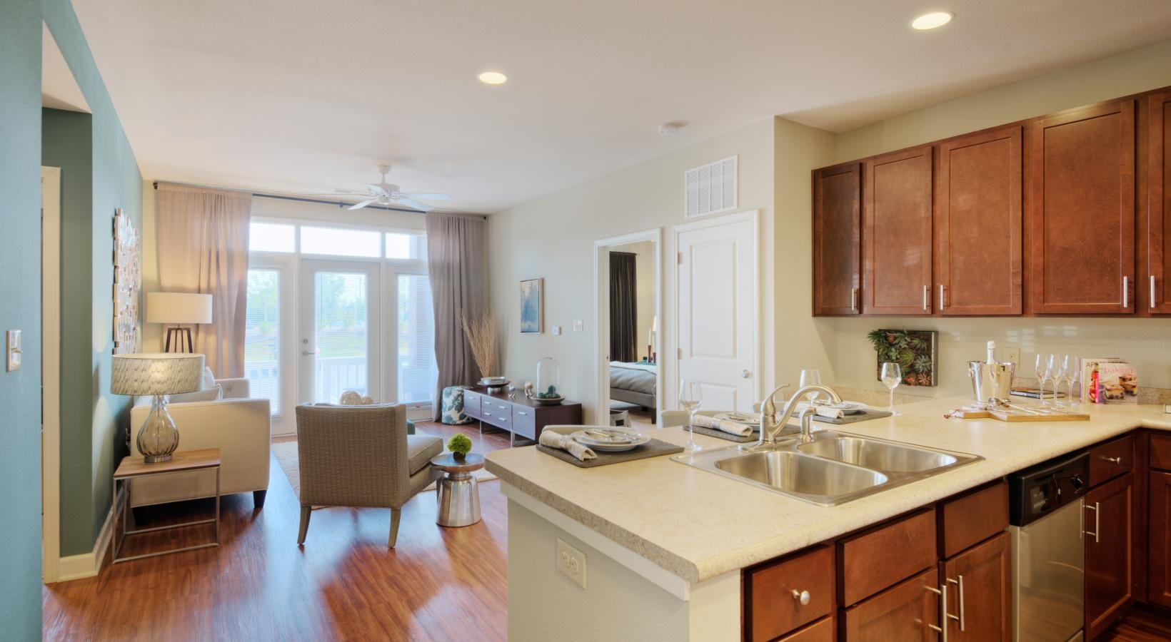 Generous living spaces to relax and unwind a kitchen with wooden cabinets