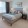 a bedroom with a bed and a desk