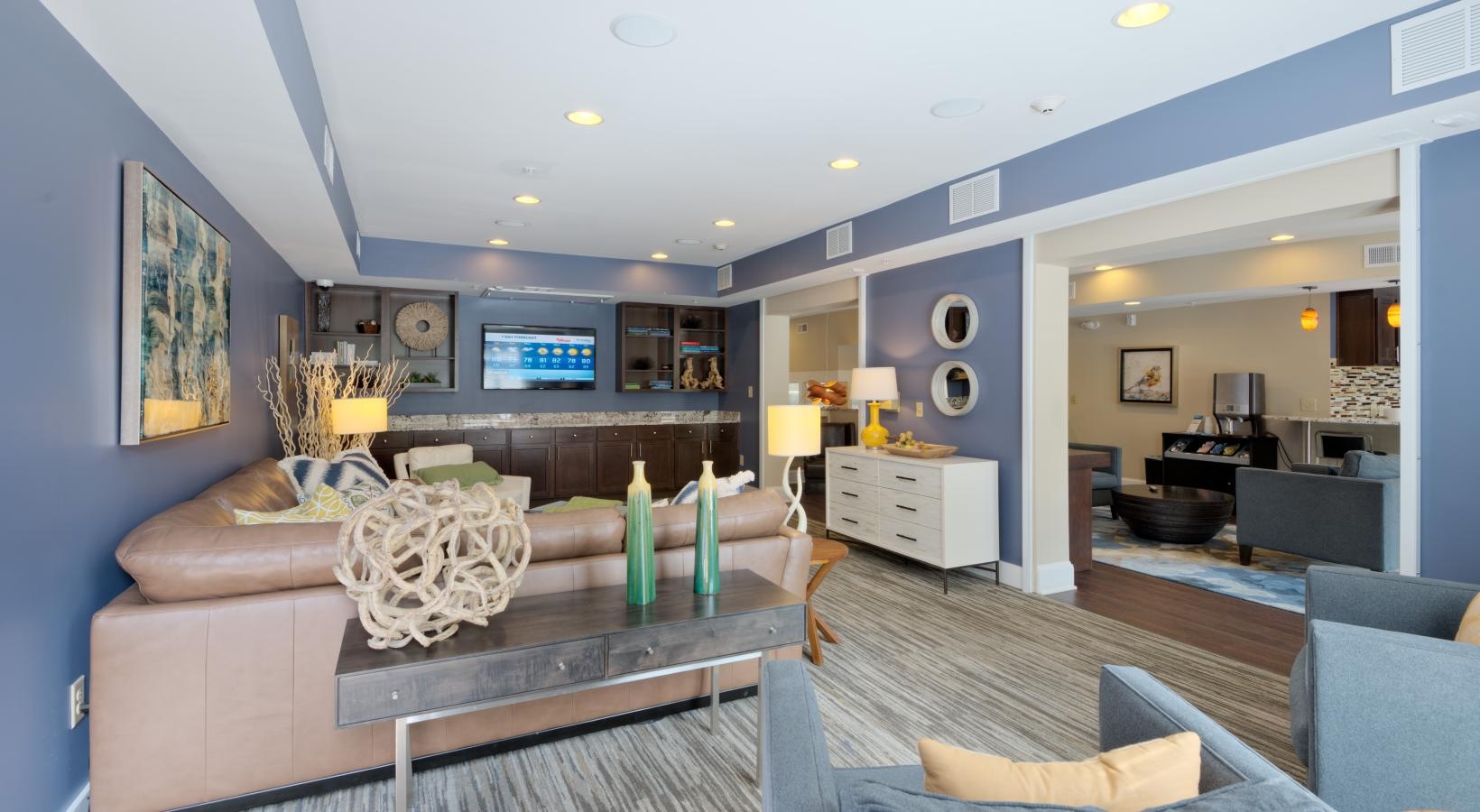 Access to resident-only features a clubhouse room with a couch and a table