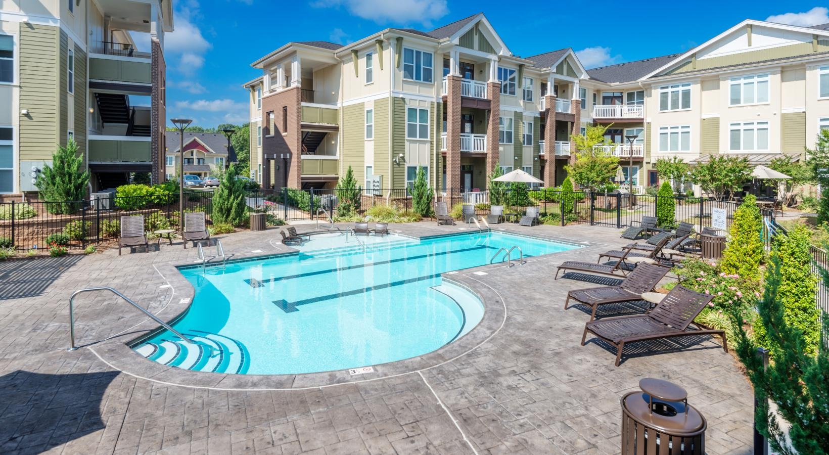 Sparkling swimming pool a swimming pool in front of buildings