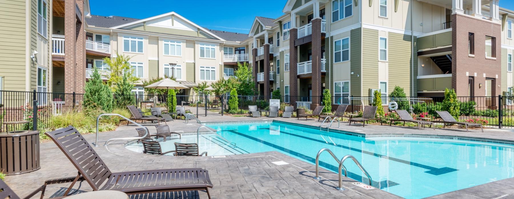 a pool in front of buildings