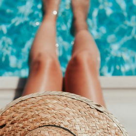 Sparkling swimming pool a woman sitting at a pool