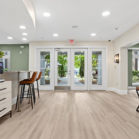 clubroom with wood floors and coffee bar