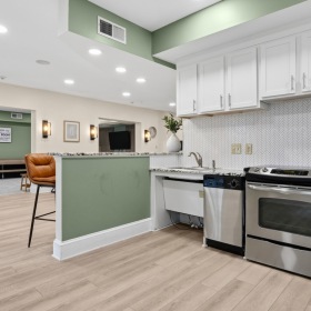 kitchen with white cabinets and stainless steel range