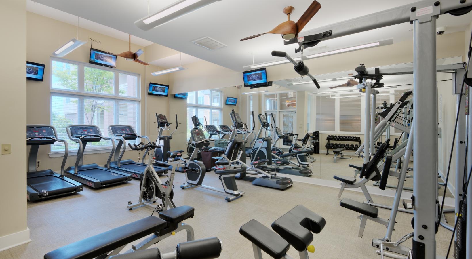 State-of-the-art amenities a gym with exercise equipment