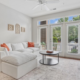 living room with couch coffee table and area rug